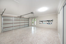 Load image into Gallery viewer, Wall mounted surfboard racks in garage powder coated black to hold 2 surfboards or mal